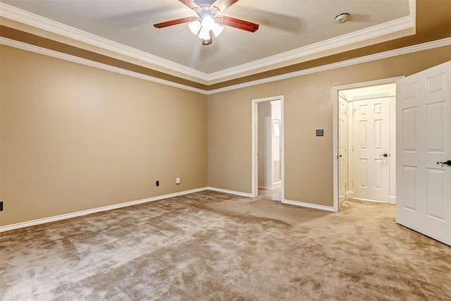 5802 Ashmere Ln, Spring, TX 77379 - unfurnished bedroom featuring ornamental molding, light colored carpet, baseboards, a ceiling fan, and a raised ceiling