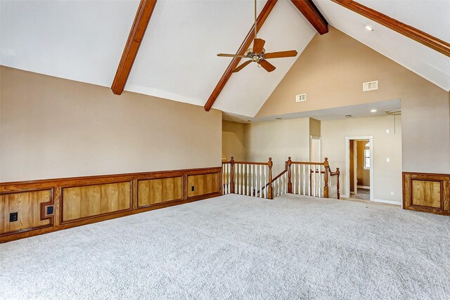 5802 Ashmere Ln, Spring, TX 77379 - empty room with high vaulted ceiling, beamed ceiling, carpet, a ceiling fan, and recessed lighting