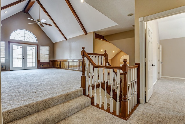 5802 Ashmere Ln, Spring, TX 77379 - staircase featuring carpet flooring, high vaulted ceiling, ceiling fan, beam ceiling, and wainscoting