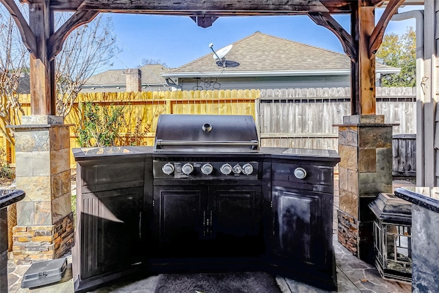 5802 Ashmere Ln, Spring, TX 77379 - view of patio / terrace with exterior kitchen