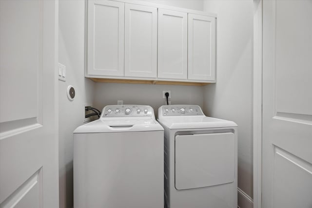 5405 Larkin St, Houston, TX 77007 - washroom featuring cabinet space and independent washer and dryer
