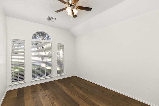 10906 Bernalda Cir, Richmond, TX 77406 - unfurnished room featuring healthy amount of natural light, baseboards, lofted ceiling, and dark wood-style floors