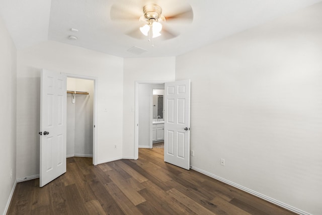10906 Bernalda Cir, Richmond, TX 77406 - unfurnished bedroom featuring dark wood finished floors, baseboards, vaulted ceiling, ceiling fan, and a closet