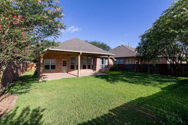 10906 Bernalda Cir, Richmond, TX 77406 - back of property featuring a patio, brick siding, and roof with shingles