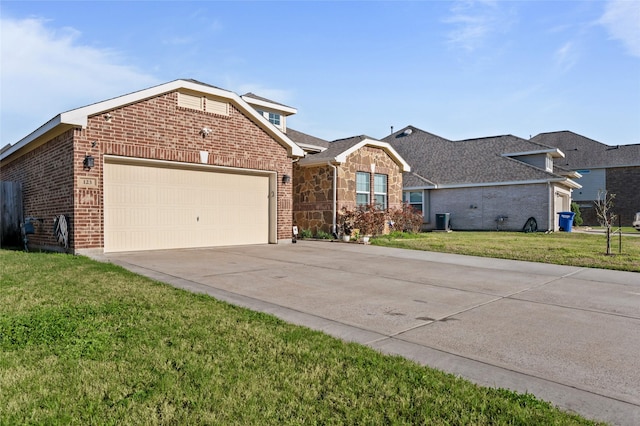 123 San Gabriel Dr, Baytown, TX 77523 - view of front facade featuring an attached garage, driveway, brick siding, and a front yard