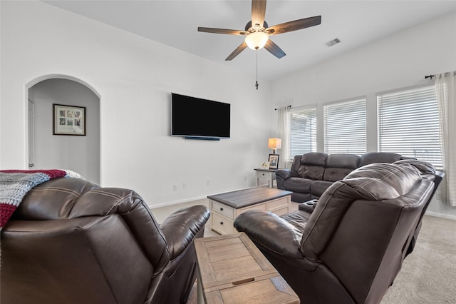 123 San Gabriel Dr, Baytown, TX 77523 - living area featuring light colored carpet, a ceiling fan, arched walkways, and baseboards