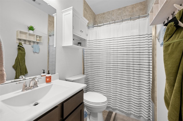 123 San Gabriel Dr, Baytown, TX 77523 - full bathroom featuring vanity, toilet, and a shower with shower curtain