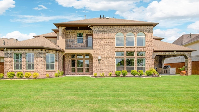 2515 Rainflower Meadow Ln, Katy, TX 77494 - rear view of property featuring brick siding, a balcony, a shingled roof, and an attached garage