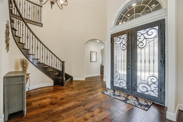 2515 Rainflower Meadow Ln, Katy, TX 77494 - foyer entrance with arched walkways, a chandelier, hardwood / wood-style flooring, french doors, and stairs