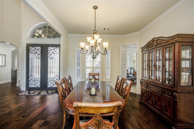 2515 Rainflower Meadow Ln, Katy, TX 77494 - dining space with arched walkways, french doors, a chandelier, dark wood-style flooring, and crown molding