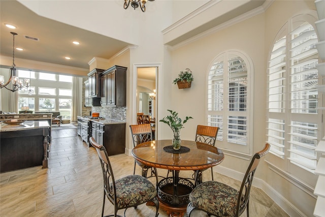 2515 Rainflower Meadow Ln, Katy, TX 77494 - dining area with a chandelier, ornamental molding, baseboards, and recessed lighting