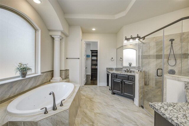 2515 Rainflower Meadow Ln, Katy, TX 77494 - bathroom featuring decorative columns, vanity, a stall shower, a tub with jets, and a walk in closet