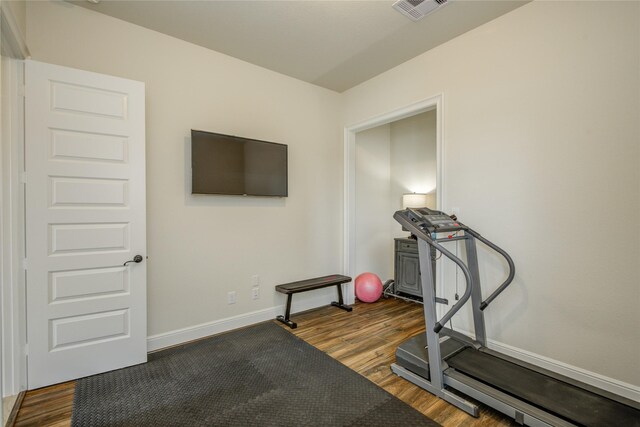 2515 Rainflower Meadow Ln, Katy, TX 77494 - workout area with dark wood-type flooring and baseboards