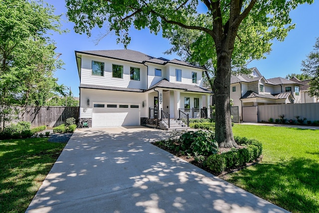 802 W 30th St, Houston, TX 77018 - view of front facade featuring driveway, an attached garage, and stone siding