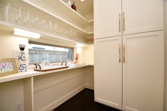 802 W 30th St, Houston, TX 77018 - kitchen with open shelves, light countertops, dark wood finished floors, and white cabinetry