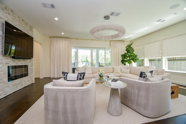 802 W 30th St, Houston, TX 77018 - living area with dark wood-type flooring, a stone fireplace, and recessed lighting