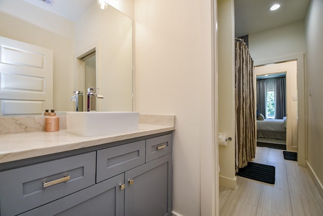 802 W 30th St, Houston, TX 77018 - bathroom with vanity, tile patterned flooring, baseboards, and recessed lighting