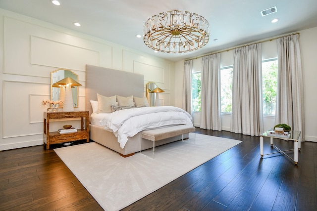 802 W 30th St, Houston, TX 77018 - bedroom with recessed lighting, dark wood-style flooring, and a decorative wall