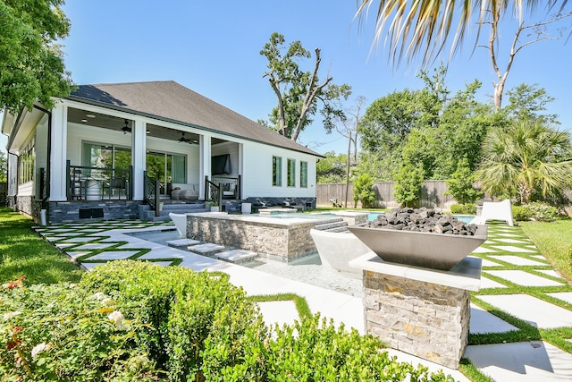 802 W 30th St, Houston, TX 77018 - view of patio / terrace featuring ceiling fan, an in-ground hot tub, and an outdoor fire pit
