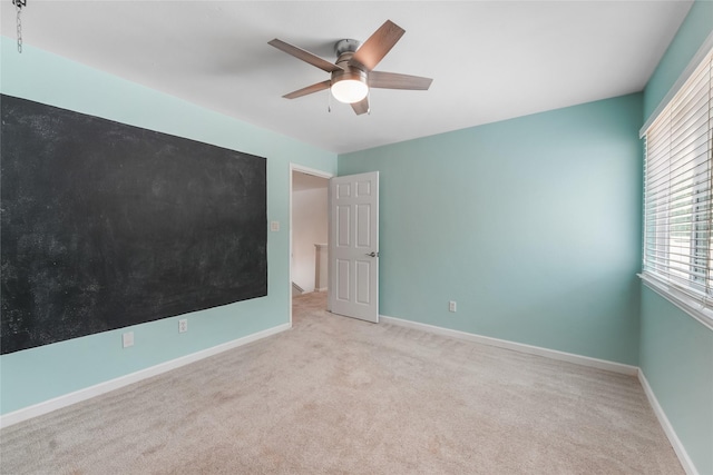 255 S Crimson Clover Ct, The Woodlands, TX 77381 - empty room featuring carpet flooring, a ceiling fan, and baseboards