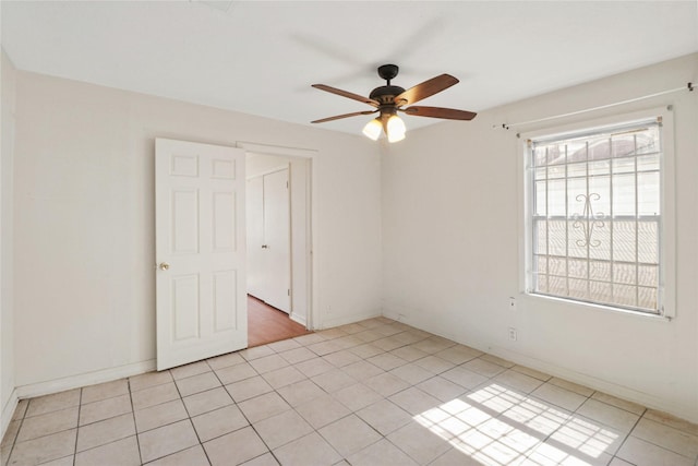 7547 Touchstone St, Houston, TX 77028 - empty room featuring ceiling fan, light tile patterned floors, and baseboards