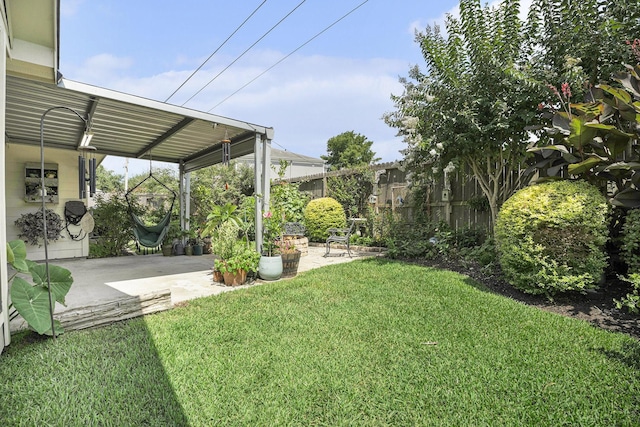 2909 Landing Edge Ln, Dickinson, TX 77539 - view of yard featuring a patio area and an attached carport