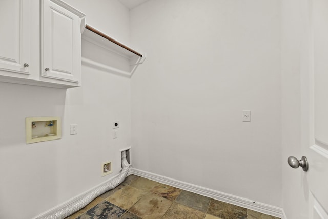 512 Cherry Hills Dr, Huntsville, TX 77340 - laundry room with hookup for an electric dryer, baseboards, stone finish flooring, cabinet space, and washer hookup