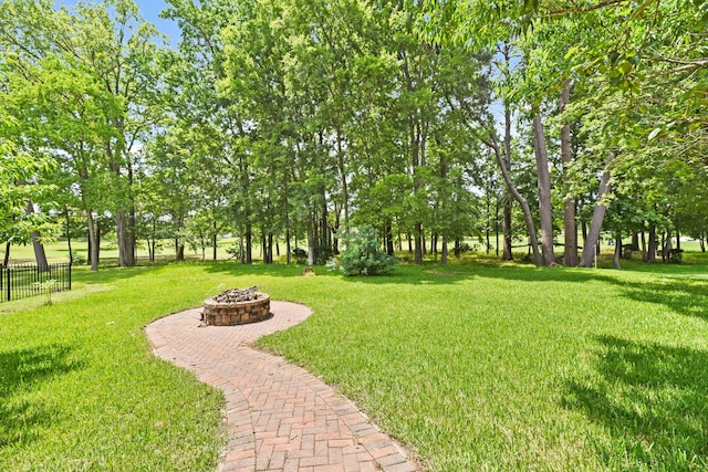 512 Cherry Hills Dr, Huntsville, TX 77340 - view of yard featuring an outdoor fire pit