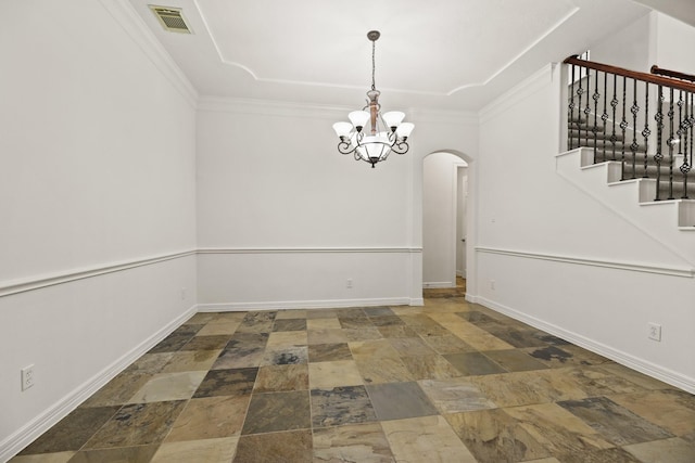 512 Cherry Hills Dr, Huntsville, TX 77340 - unfurnished room with stone finish floors, arched walkways, a chandelier, baseboards, and crown molding