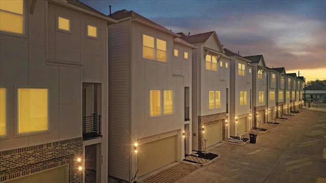 8307 Brecha Ln, Houston, TX 77055 - view of property at dusk