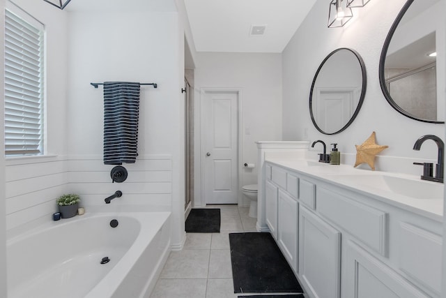 15511 Bosque Valley Ct, Cypress, TX 77433 - bathroom featuring double vanity, tile patterned flooring, a garden tub, toilet, and a stall shower