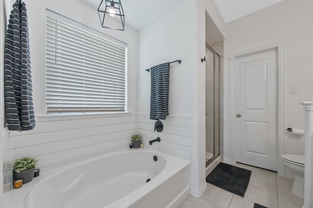 15511 Bosque Valley Ct, Cypress, TX 77433 - bathroom with a bath, tile patterned flooring, a stall shower, and toilet