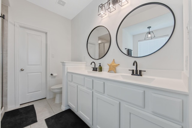 15511 Bosque Valley Ct, Cypress, TX 77433 - bathroom featuring double vanity, toilet, tile patterned flooring, and a shower with shower door