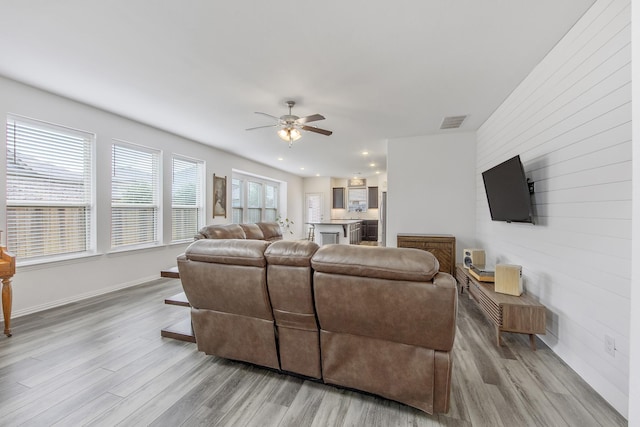 15511 Bosque Valley Ct, Cypress, TX 77433 - living area with light wood finished floors, a ceiling fan, baseboards, and recessed lighting