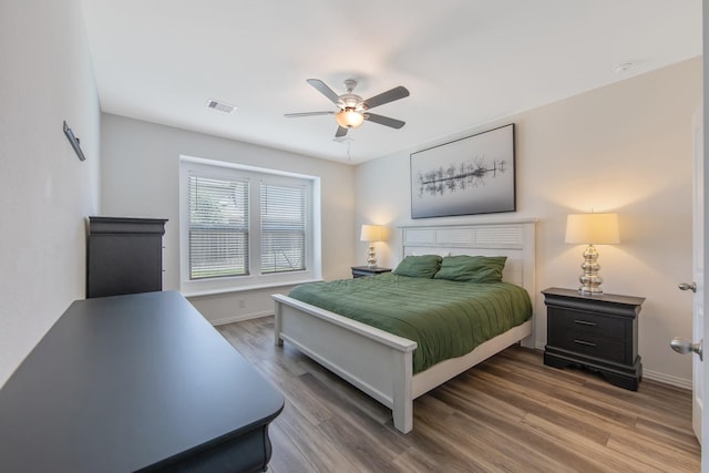 15511 Bosque Valley Ct, Cypress, TX 77433 - bedroom featuring wood finished floors, baseboards, and a ceiling fan