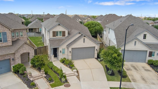 15511 Bosque Valley Ct, Cypress, TX 77433 - view of front facade featuring a residential view, a garage, roof with shingles, and concrete driveway