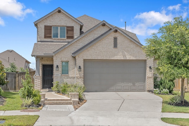 15511 Bosque Valley Ct, Cypress, TX 77433 - view of front facade with a shingled roof, concrete driveway, a garage, and brick siding