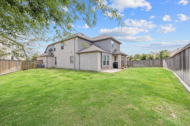 15511 Bosque Valley Ct, Cypress, TX 77433 - back of house featuring central air condition unit, a patio area, and brick siding