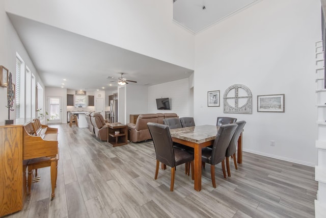 15511 Bosque Valley Ct, Cypress, TX 77433 - dining room featuring light wood-style flooring, a ceiling fan, baseboards, and recessed lighting