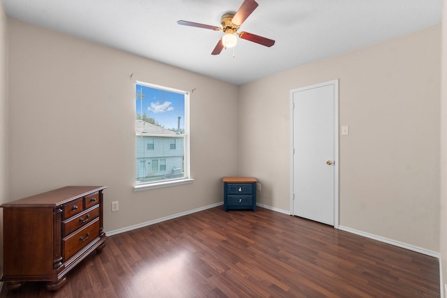 16338 N Glade, Houston, TX 77073 - unfurnished bedroom featuring dark wood-type flooring, baseboards, and ceiling fan