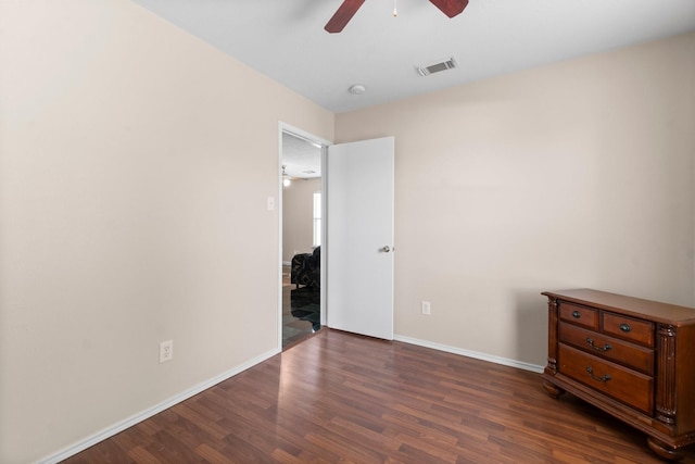 16338 N Glade, Houston, TX 77073 - unfurnished bedroom featuring dark wood-style flooring, baseboards, and ceiling fan
