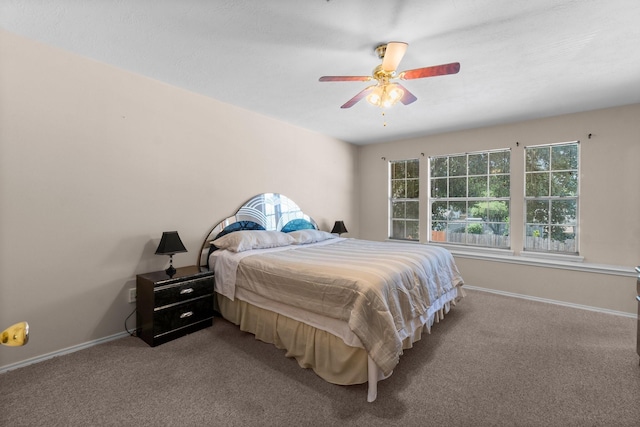 16338 N Glade, Houston, TX 77073 - carpeted bedroom featuring baseboards and a ceiling fan