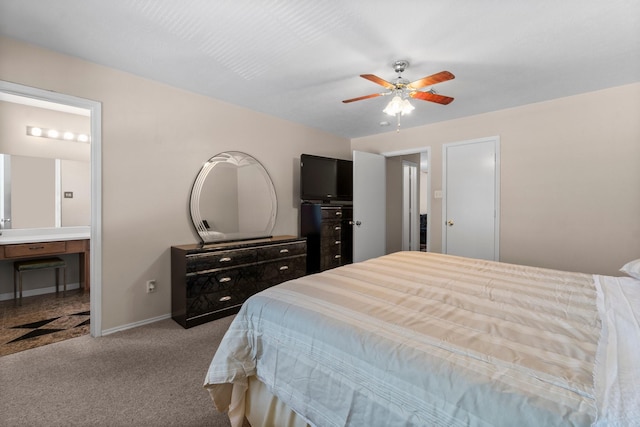 16338 N Glade, Houston, TX 77073 - carpeted bedroom with baseboards, ensuite bathroom, and a ceiling fan