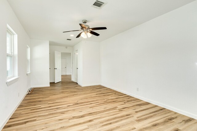 1502 W 9th St, Freeport, TX 77541 - spare room featuring light wood finished floors, baseboards, ceiling fan, and recessed lighting