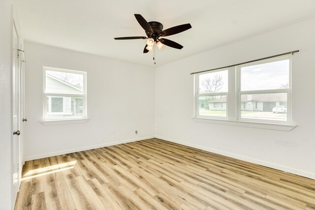 1502 W 9th St, Freeport, TX 77541 - spare room with light wood-style floors, baseboards, and ceiling fan