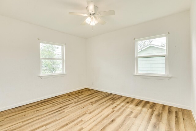 1502 W 9th St, Freeport, TX 77541 - unfurnished room with wood finished floors, baseboards, and a ceiling fan