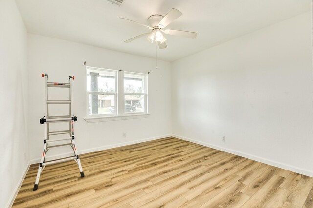 1502 W 9th St, Freeport, TX 77541 - unfurnished room with light wood-style floors, baseboards, and ceiling fan