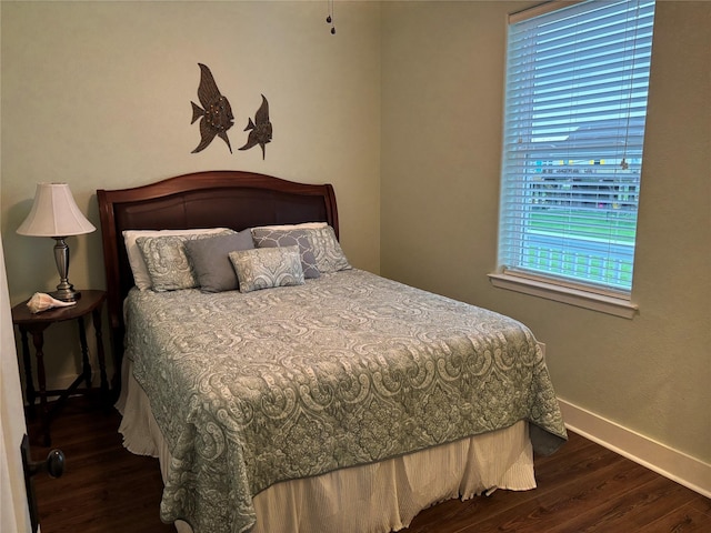 943 Sand Dune Dr, Crystal Beach, TX 77650 - bedroom featuring wood finished floors and baseboards