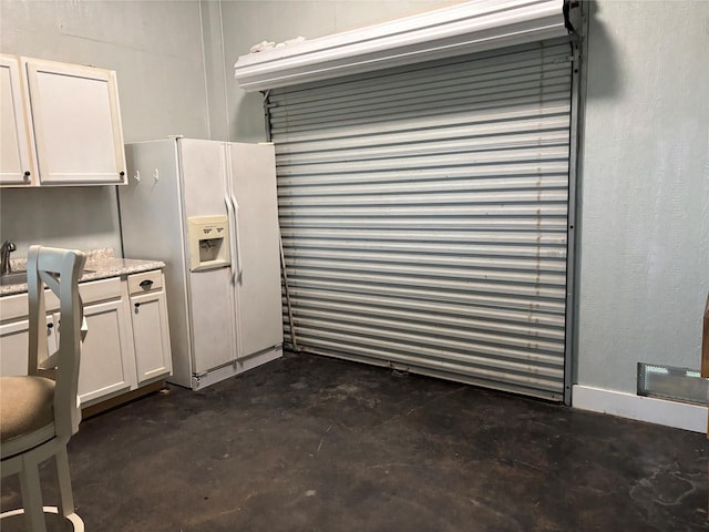 943 Sand Dune Dr, Crystal Beach, TX 77650 - garage featuring white refrigerator with ice dispenser