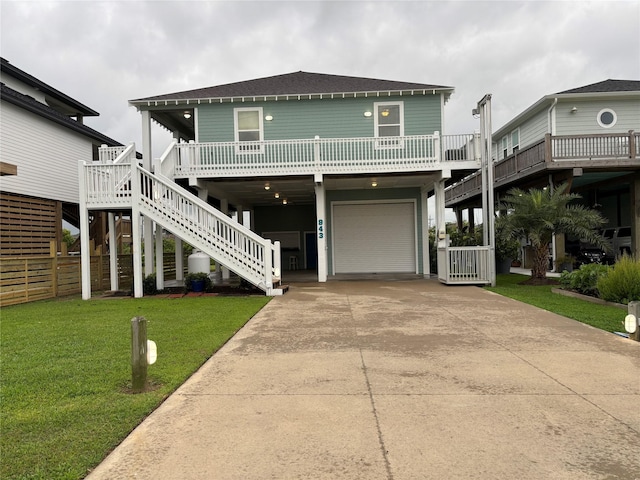 943 Sand Dune Dr, Crystal Beach, TX 77650 - view of front of home featuring driveway, a garage, a carport, and stairs